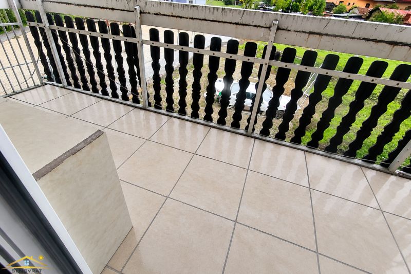 Balcony with ceramic tiles and railing, overlooking the garden in Krásno nad Kysucou.