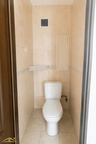 Bathroom spaces with WC, simple and clean design in a 3-room apartment.