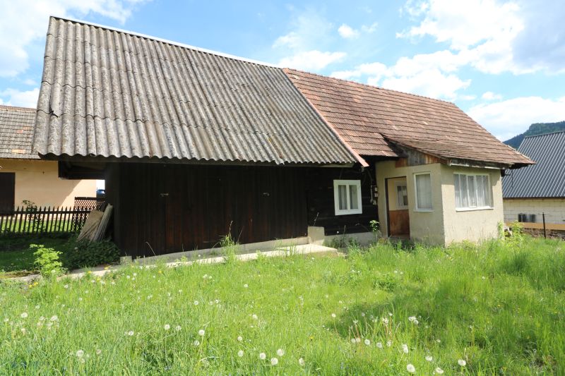 An older house with a metal roof on Matúšovská Street in Žaškov, surrounded by grass.