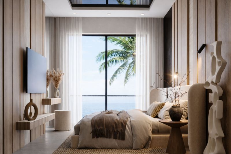A bright bedroom with a large window, a bed, and decorations in a two-room apartment.
