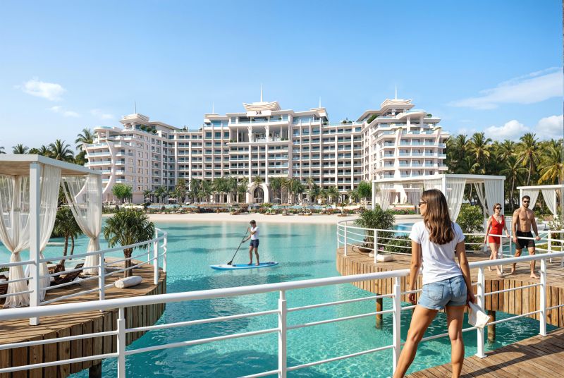 A luxury beachfront building in Paje, surrounded by palm trees and crystal-clear water.