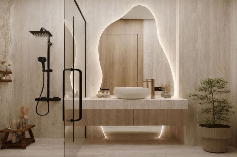 Elegant bathroom with a modern shower and backlit mirror in a 2-room apartment.