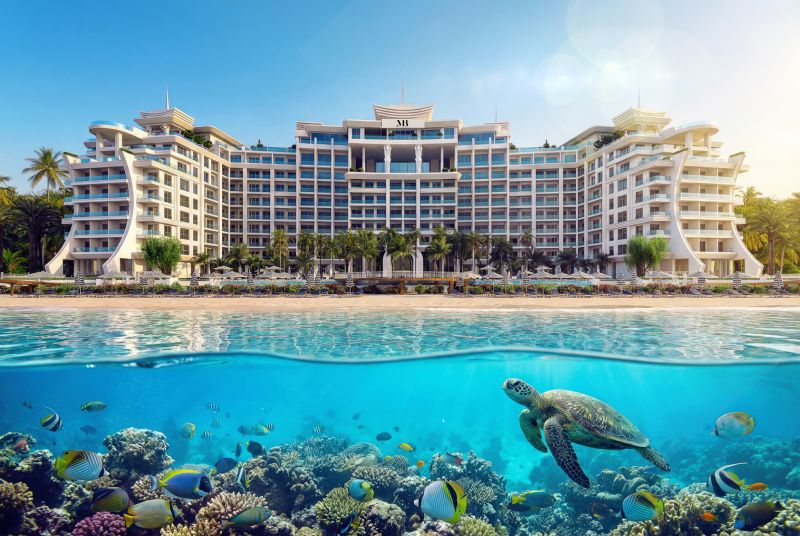 Beachfront hotel in Paje, with a turtle and colorful fish in the foreground.