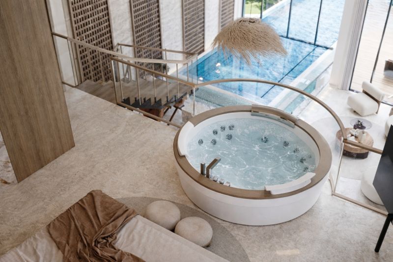 Interior with a hot tub and a view of the pool in a 4-room apartment.