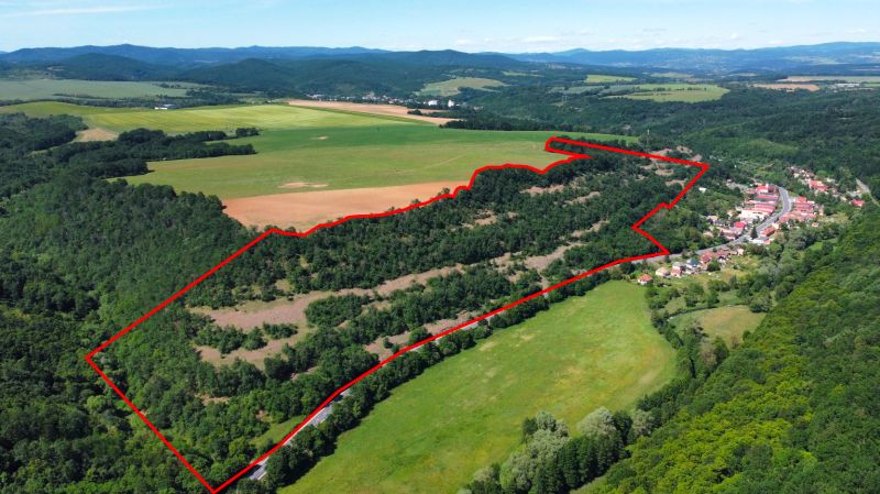 Aerial view of agricultural and forest land surrounded by nature near the village of Domaníky.
