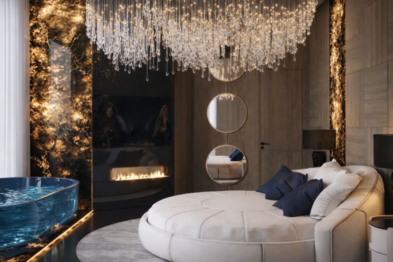 Luxury bedroom in a 5 or more room apartment with a central chandelier and fireplace.