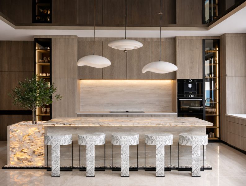 A kitchen in a 5 or more room apartment with an island and lighting.