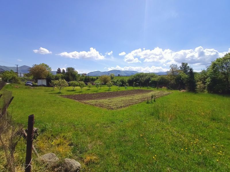 Garden on residential plots on Hlboká Street in Turany with a view of the mountains.