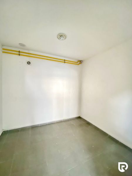 Empty room with tiles, piping, on Zlatovská Street suitable for commercial premises.