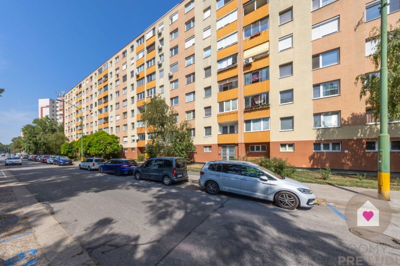 Apartment building on Švabinského Street in Bratislava – Petržalka, parking of cars in front of the building.