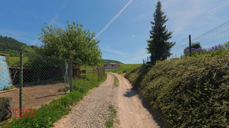 A country road in Lietavská Svinná-Babkov leads to a house, ideal for plots - living.