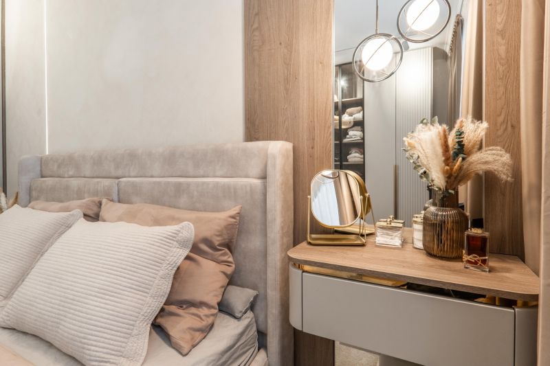 A bedroom in a 3-room apartment with a bed, a mirror, and decorative elements.