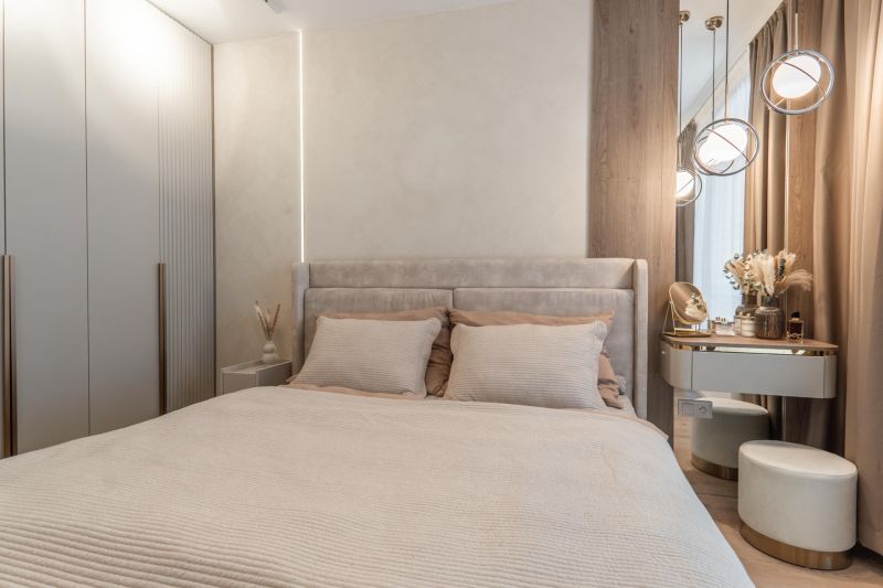 A bedroom in a 3-room apartment with a bed, wardrobe, and elegant lighting.