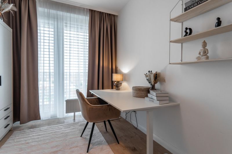 A workspace with a desk, a comfortable chair, and a shelf in a 3-room apartment.