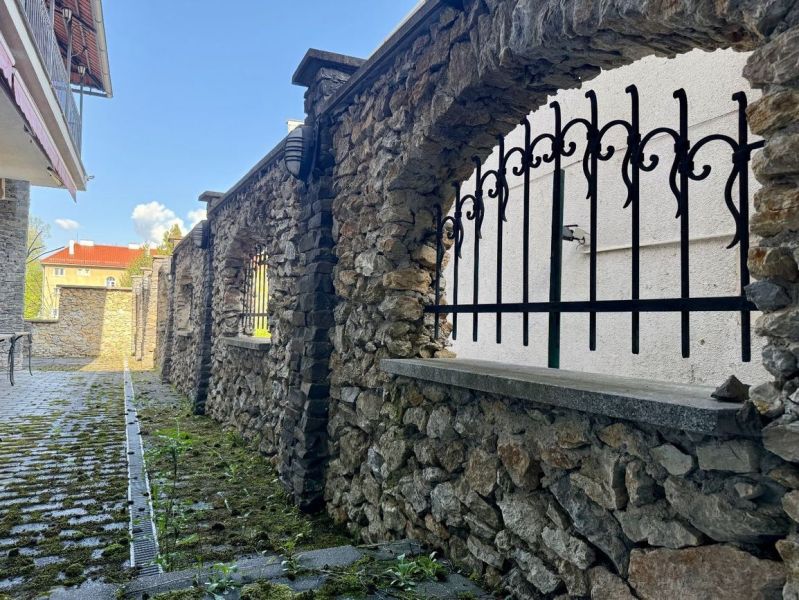 Stone wall and iron bars on Dolná Street in Banská Bystrica.