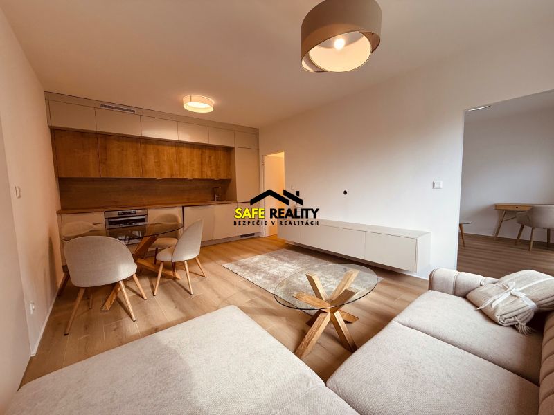Living room with wood-patterned flooring and kitchen in a 3-room apartment.
