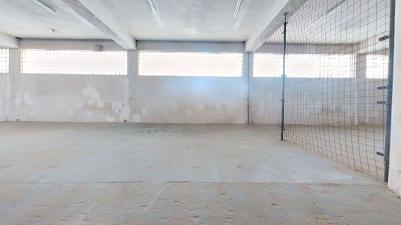 Warehouses and halls with concrete floors and skylights on the walls.