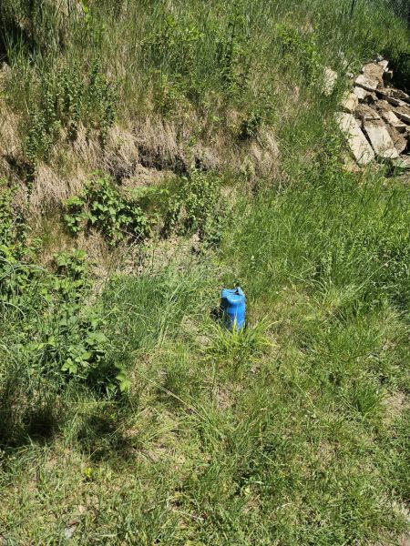 Blue canvas on green grass near the cottage in Budatín, Budatín street.