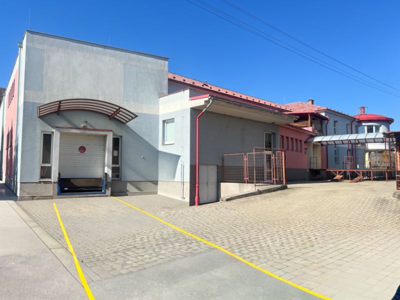 Production premises in Kremnička, Banská Bystrica with an access ramp and paving.