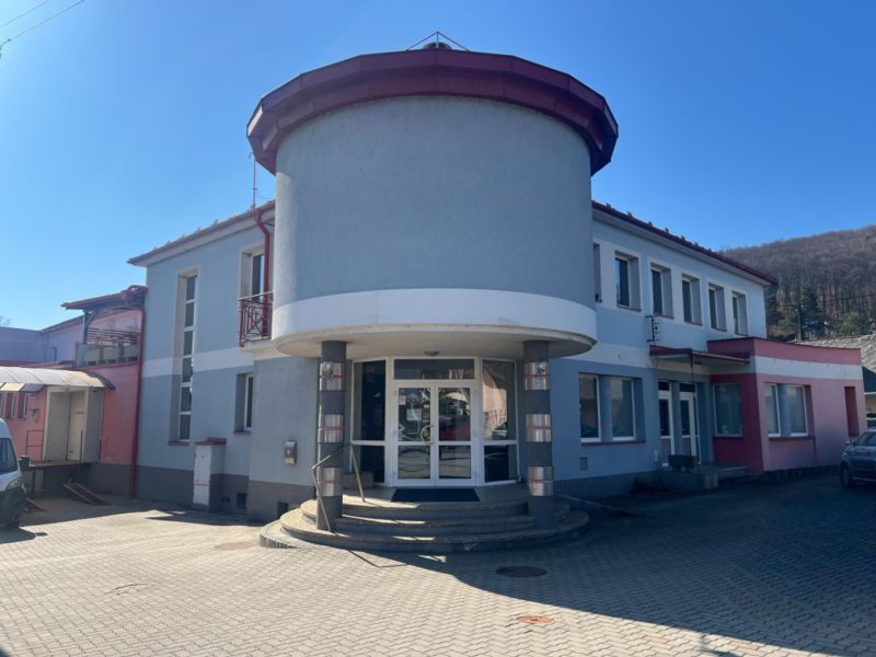 Building with an arched entrance in Kremnička, Banská Bystrica, serving as warehouses and halls.