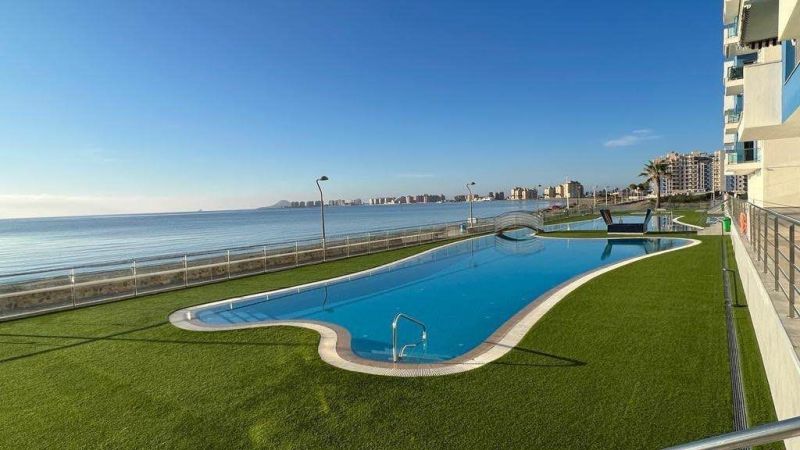 Recreational apartment in La Manga del Mar Menor, Spain, with a pool by the sea.
