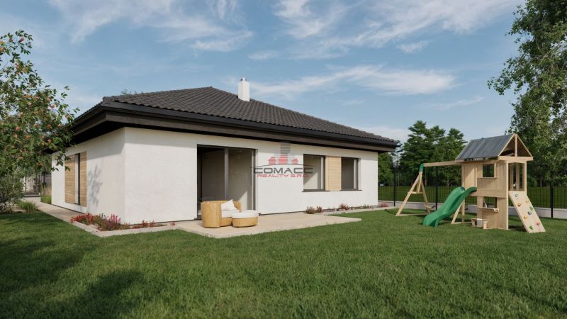 A family house on Kostolná Street in Drahovce with a children's playground and a well-maintained garden.