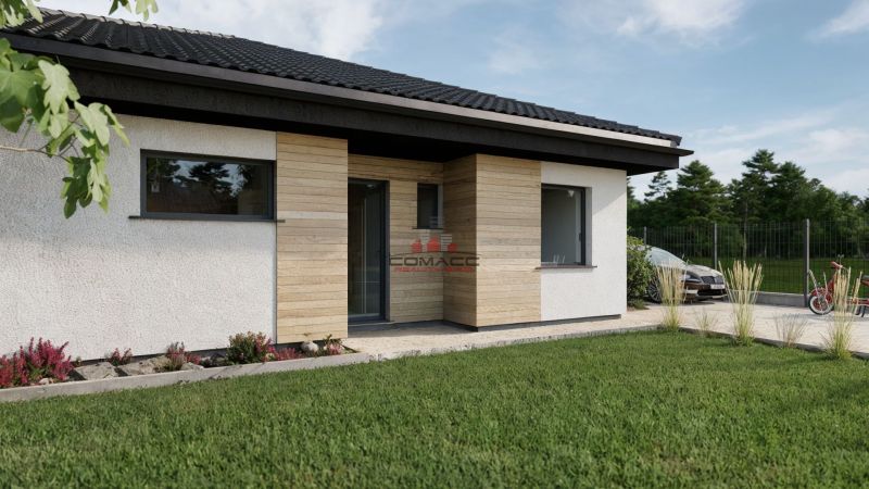 A family house on Kostolná Street in Drahovce with wooden cladding and a well-maintained garden.