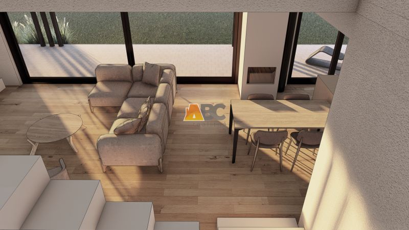 Interior view of a living room with a sofa, coffee table, and wooden decor flooring.