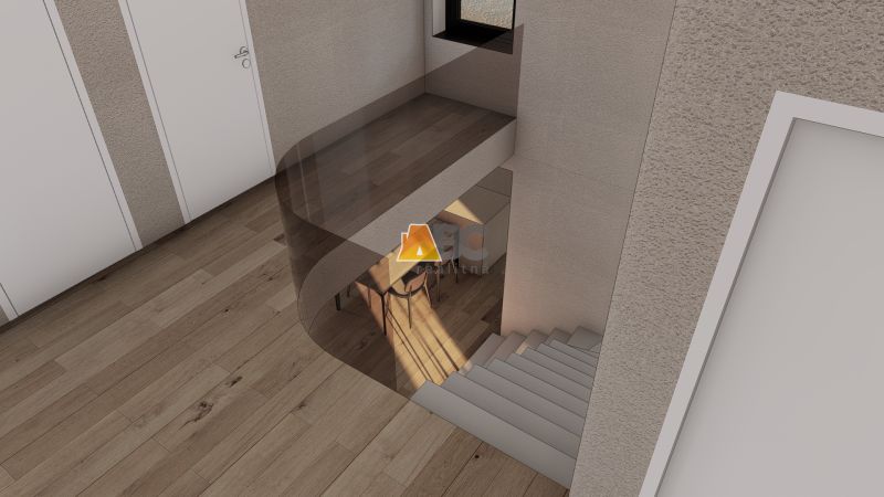 Interior with a staircase, white doors, and a wood-patterned floor.