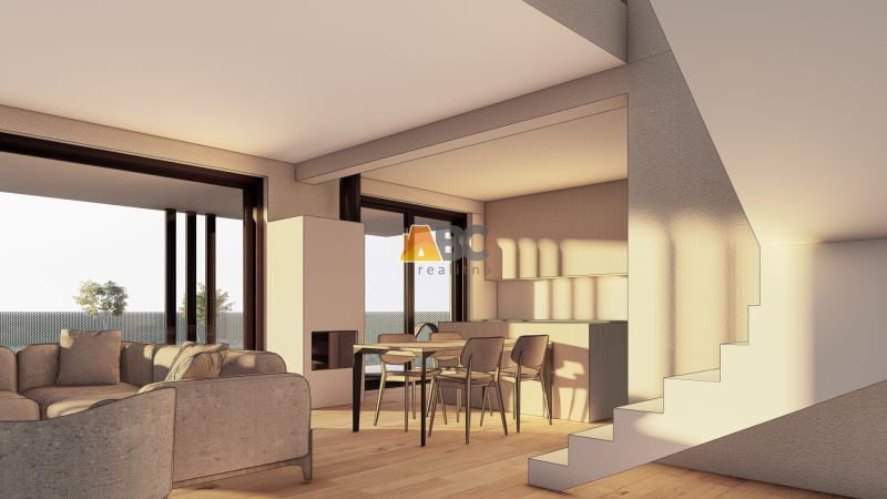 Open living space with a sofa, dining table, and wood-patterned flooring.