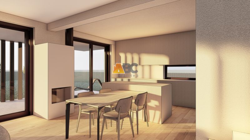 Interior with a table and chairs, with a wooden floor and large windows.