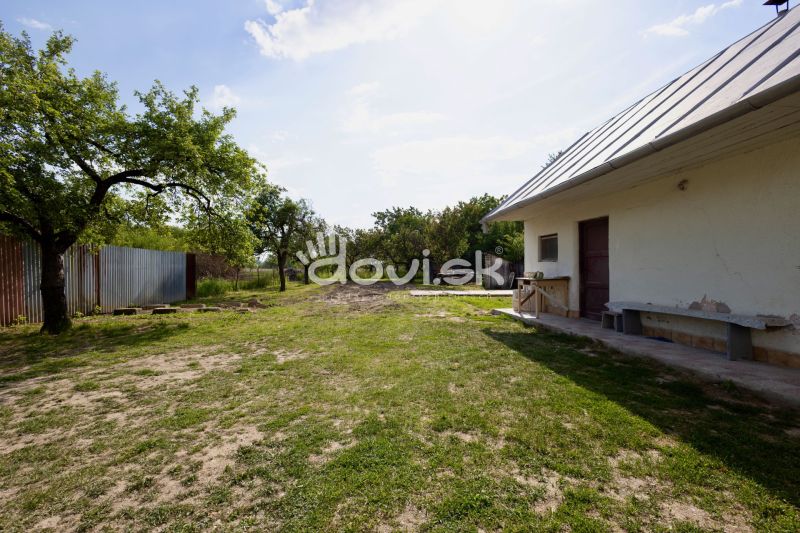 A family house in the town of Zemplínska Široká with a well-maintained garden and a shelter.