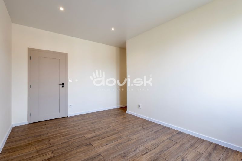 Interior of a family house with a wooden decor floor and light walls.