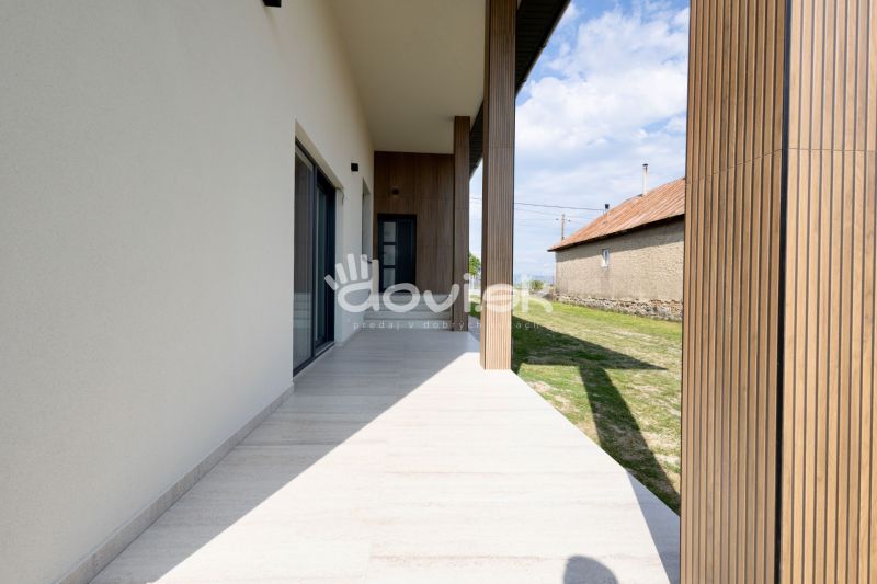 A family house in Zemplínska Široká with a terrace and modern wooden elements.