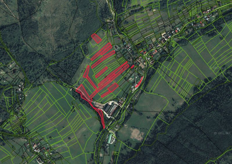 An aerial map of agricultural and forest lands around the village of Nová Bystrica.