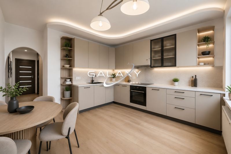 A kitchen in a 3-room apartment with a kitchen unit and a wooden decor floor.