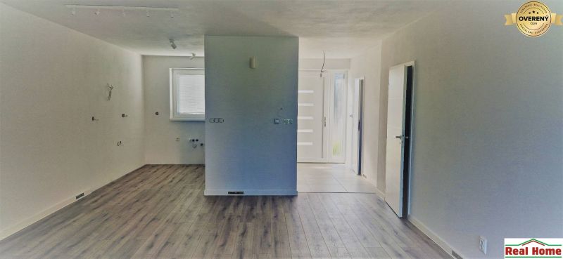 Interior of a family house with a wooden decor floor and light walls.