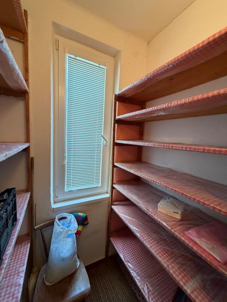 Storage space with shelves and a window, ideal for a 2-room apartment.