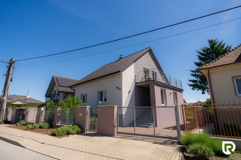 A family house on Jahodova Street in Trenčín with access through a gate and fencing.