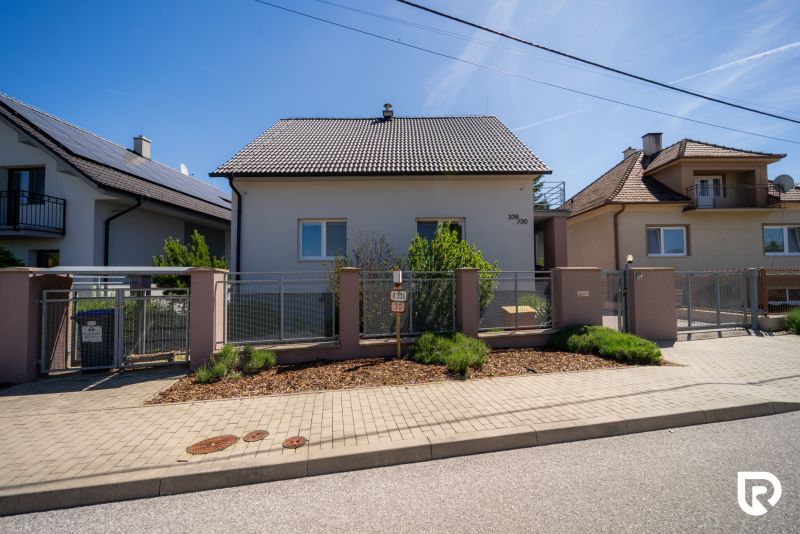 A family house on Jahodova Street in Trenčín with a landscaped front garden and a gate.