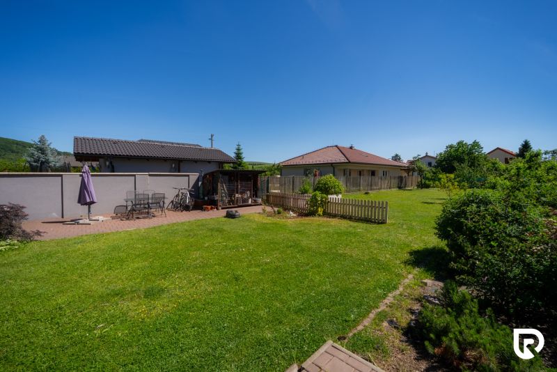 A garden at a family house on Jahodova Street in Trencin with a seating area and lawn.