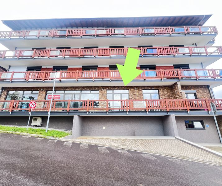 A building with balconies and a stone facade, commercial premises in Donovaly, Banská Bystrica district.