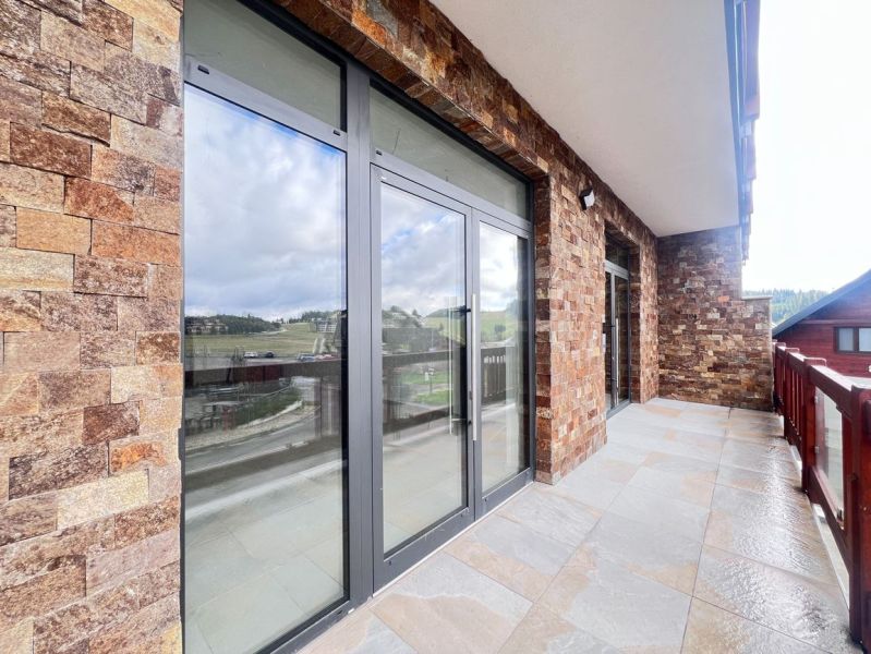 Stone terrace with glass doors in commercial premises in Donovaly, Banská Bystrica district.