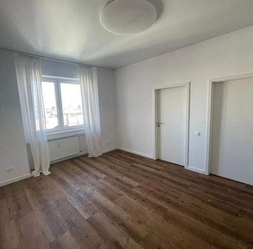 A room with a wooden floor decor, white walls, and curtains in a 3-room apartment.