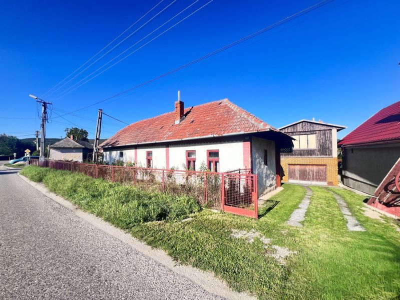 A family house in Žirany, Nitra district, Nitra region with a red roof and a garden.