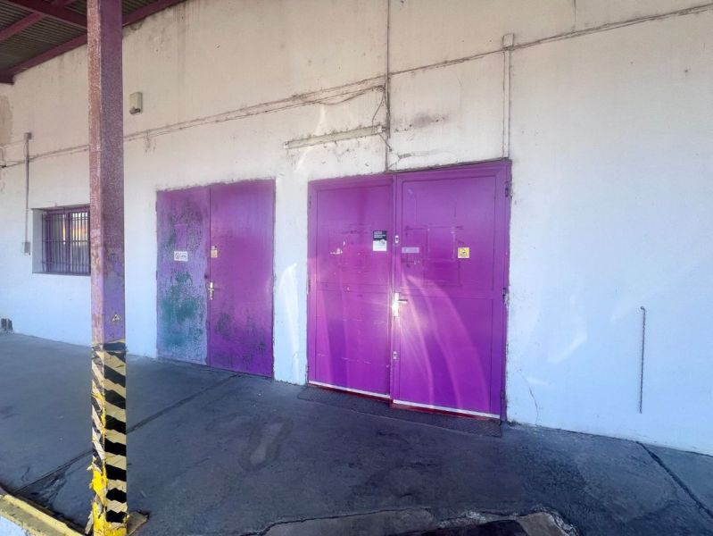 Purple doors leading to warehouses and halls on Zvolenská Street, Kráľová, Banská Bystrica.