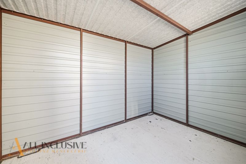 An interior with metal walls and a concrete floor in a 3-room apartment.