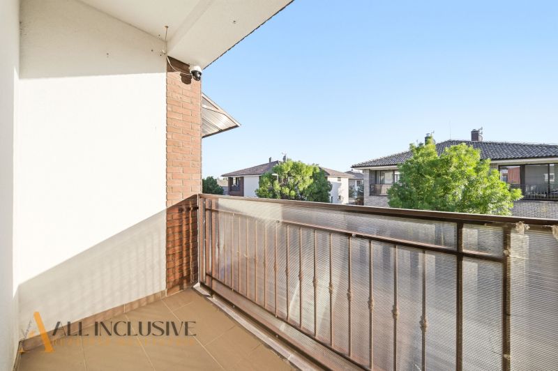 The balcony of a 3-room apartment in Dunajská Streda with a view of neighboring family houses.