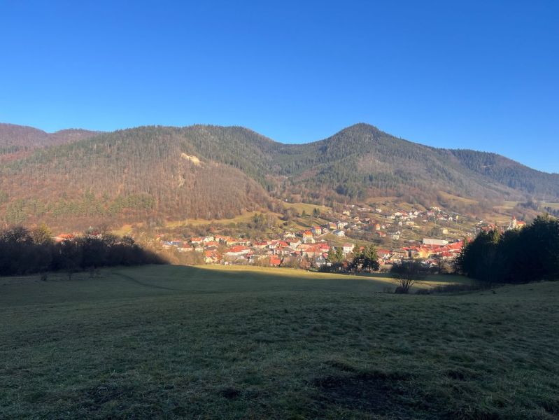 The landscape in the village of Ľubietová surrounded by mountains, village architecture, and a peaceful environment.