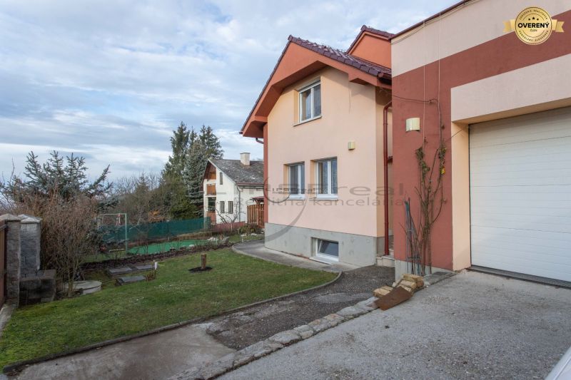 A family house on Borinská Street in Marianka with a front garden and a garage.